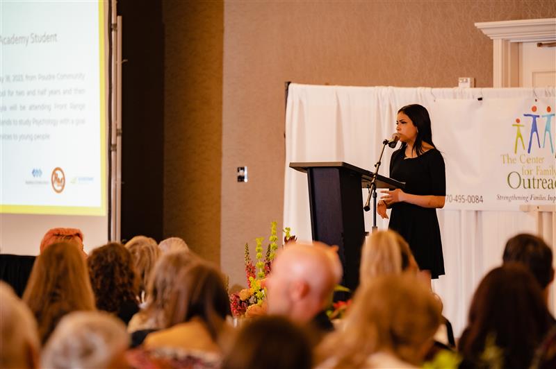 Tayia Evans shares her story about mental health at the 2023 Center for Family Outreach breakfast. 