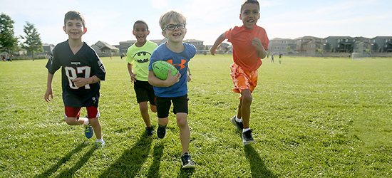 Kids running with a ball.