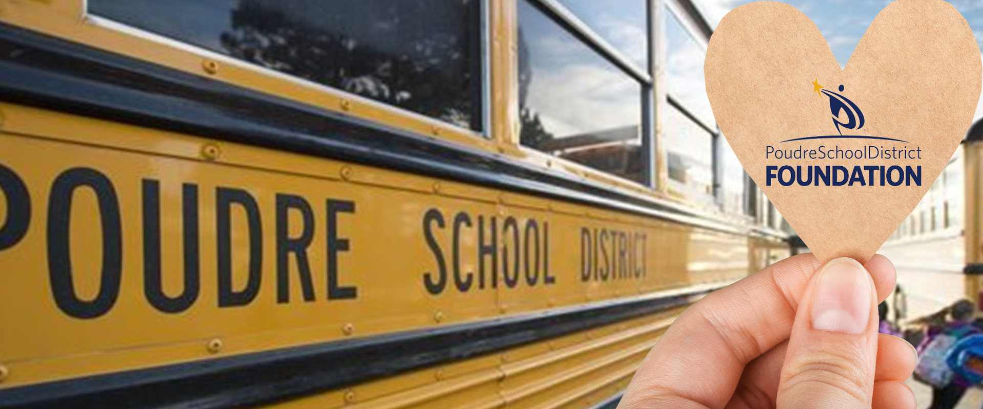 A heart that says "PSD Foundation" held up next to a PSD school bus.