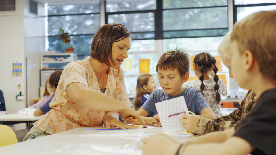 Options classroom with teacher and students learning.