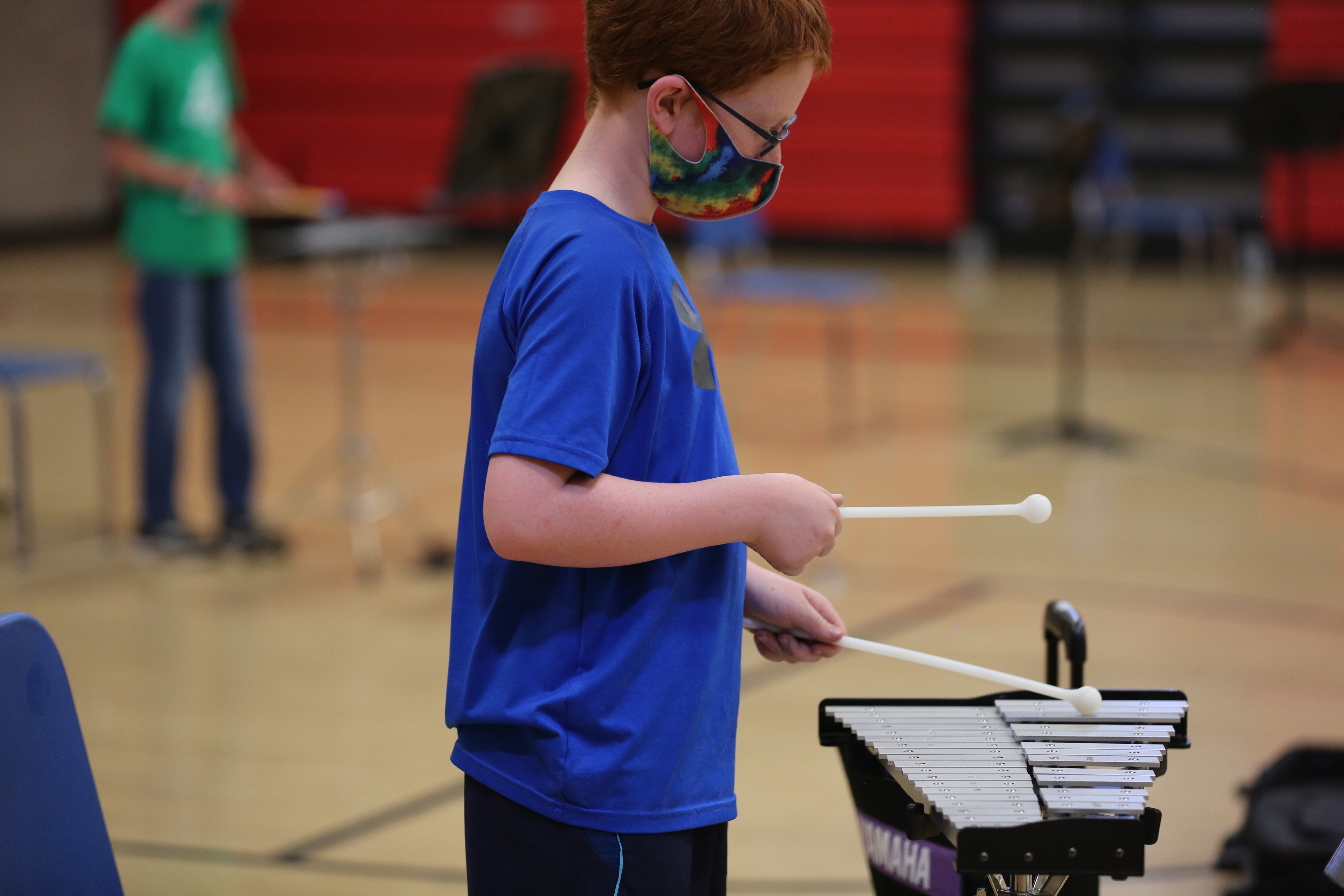 A PSD student playing a musical instrument.