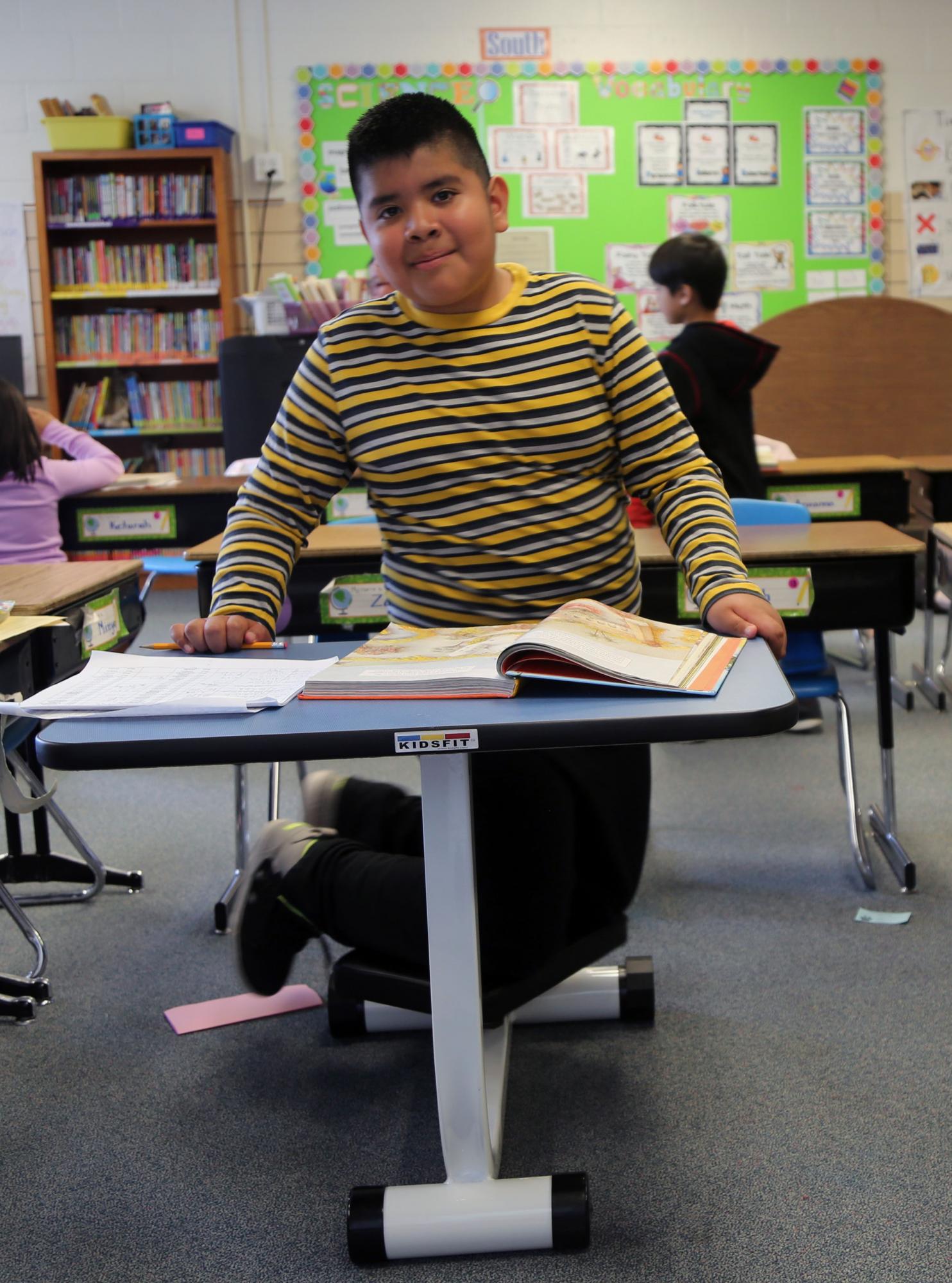 young male student on movement desk