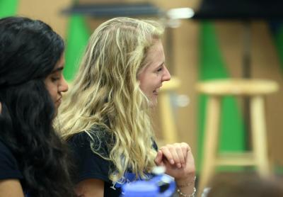 Two high school girls laughing.