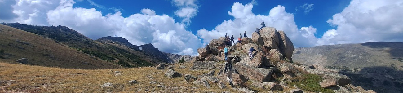 Students hike in the mountains during Eco Week.