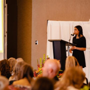 Tayia Evans shares her story at a benefit event. 