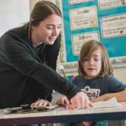 A PSD teacher with a student .