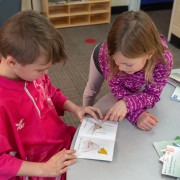 Two students read together. 