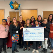 Early Childhood Education receives a grant check for their Social Emotional Library..