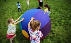 Students playing with a ball.