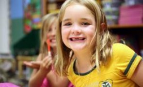 Little girl smiling a the camera.