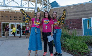 staff welcoming students to school on the first day
